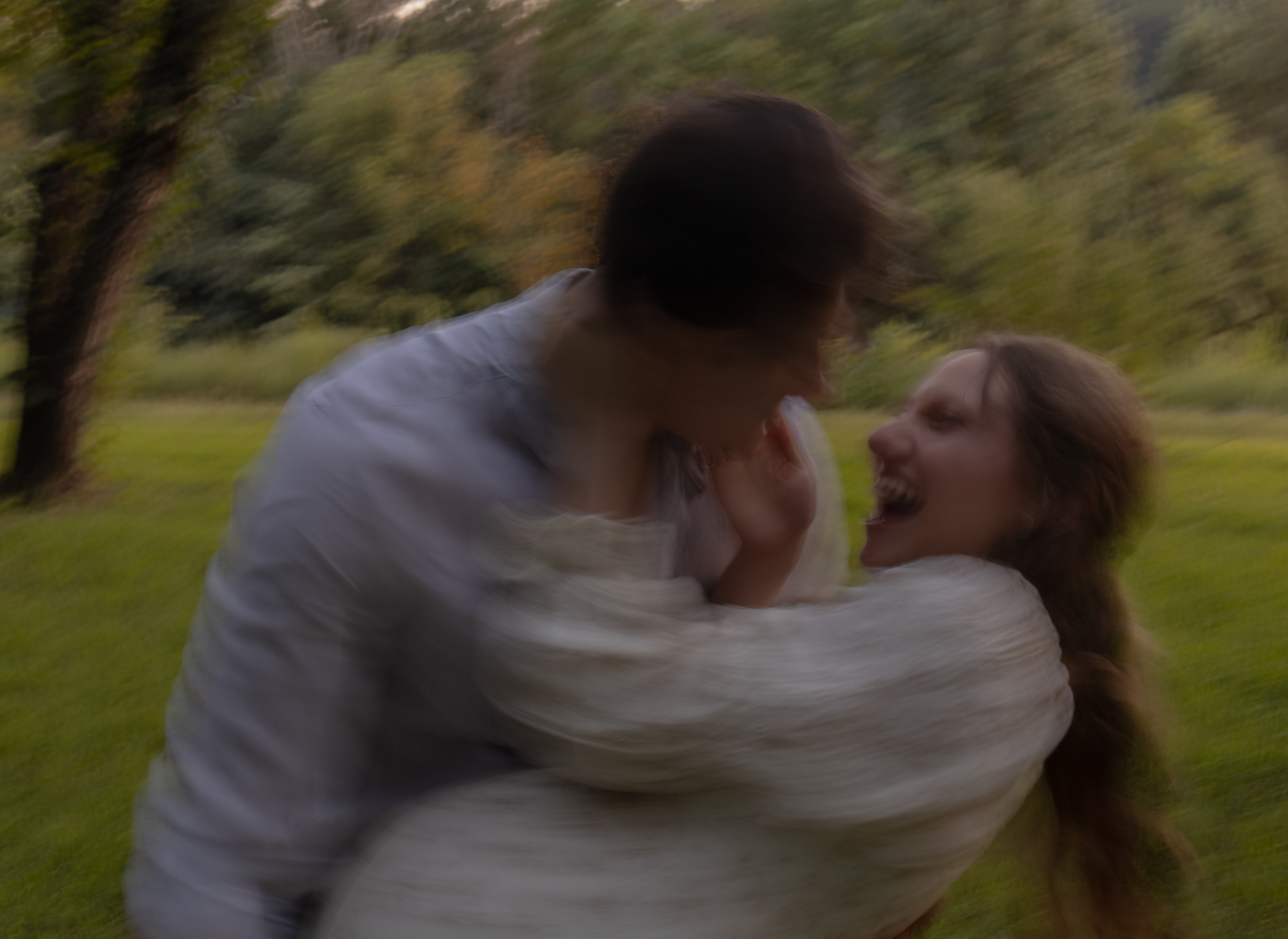 Caitlin twirling in a field