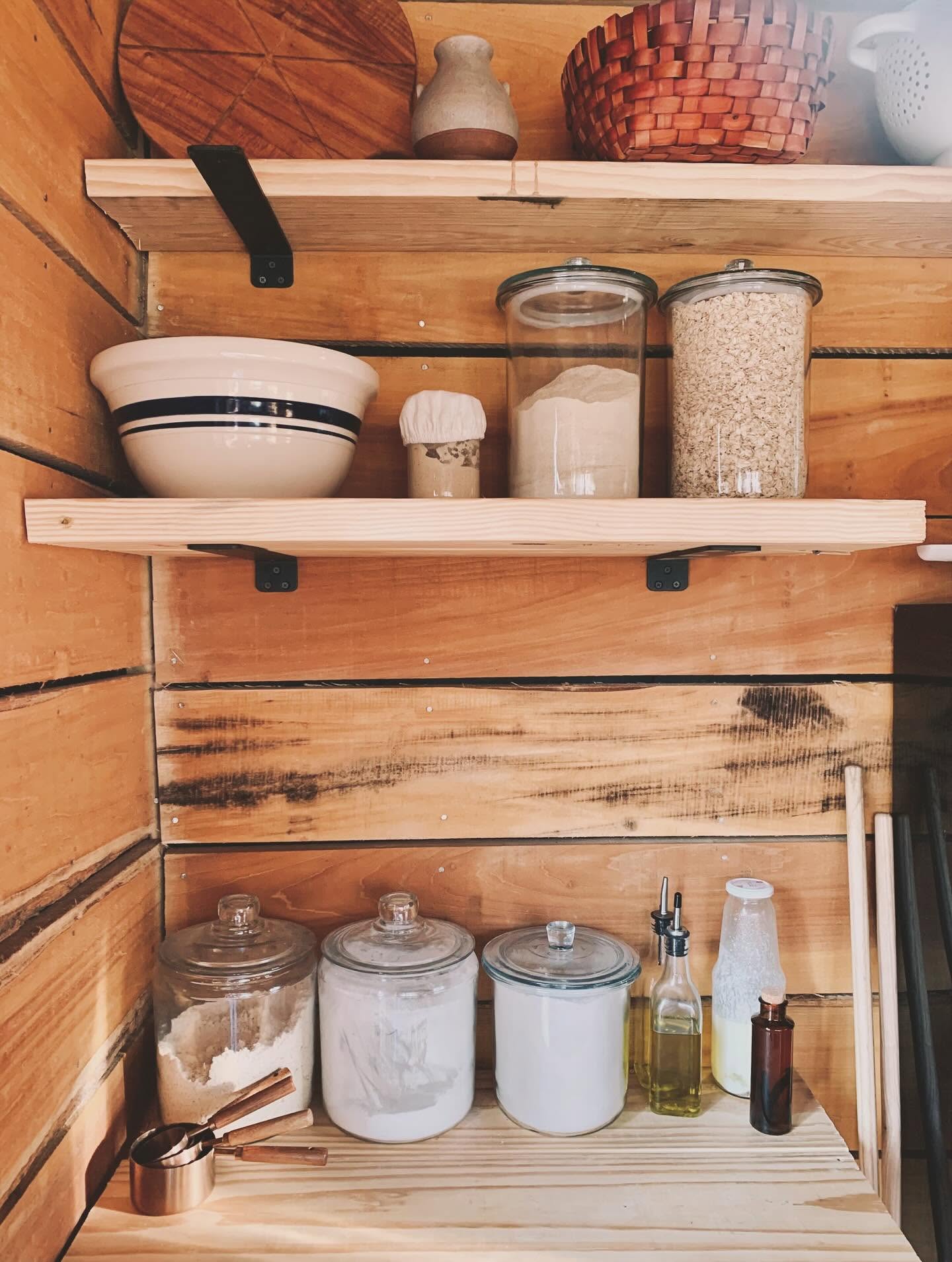Pantry shelves with jars of preserved goods