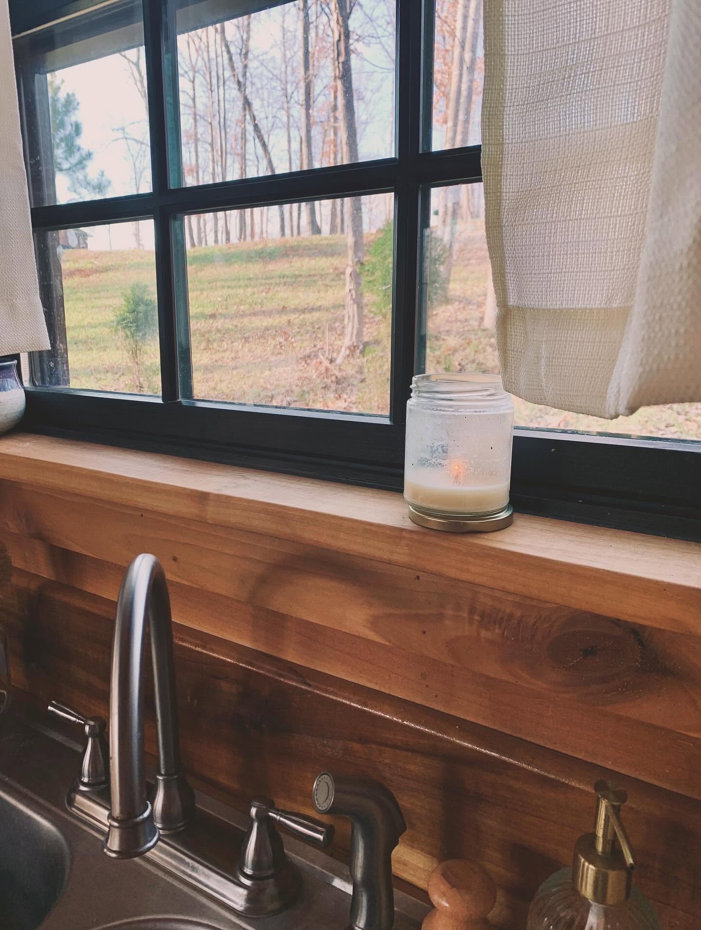 Kitchen sink looking out to the woods